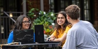 Student group studying on campus outside