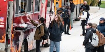 Students ordering from a food truck